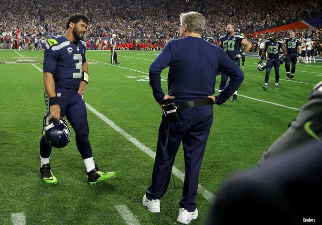 Seattle Seahawks head coach Pete Carroll and quarterback Russell Wilson (3) talk after being intercepted by New England Patriots strong safety Malcolm Butler in the final seconds of the NFL Super Bowl XLIX football game in Glendale, Arizona February 1, 2015. REUTERS/Brian Snyder (UNITED STATES  - Tags: SPORT FOOTBALL)   ORG XMIT: SBP143